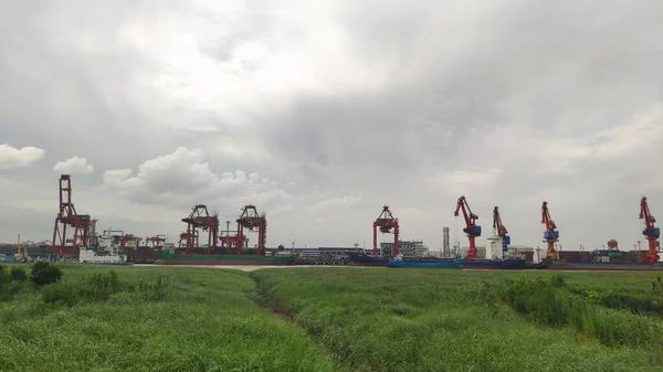 industrial landscape with cranes and river
