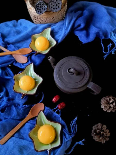 easter eggs and berries on a black background