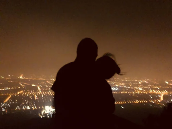 silhouette of a couple in love at night