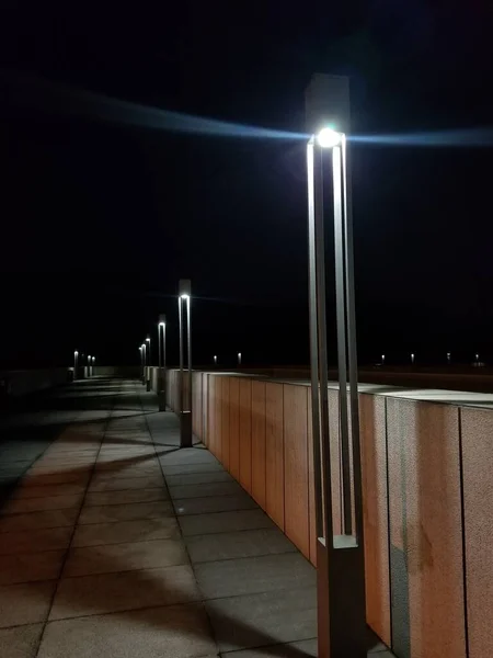 empty underground tunnel with lights and reflections