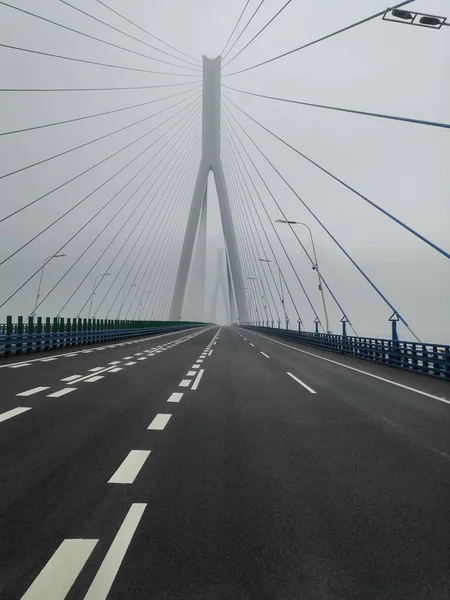 empty road with bridge and highway