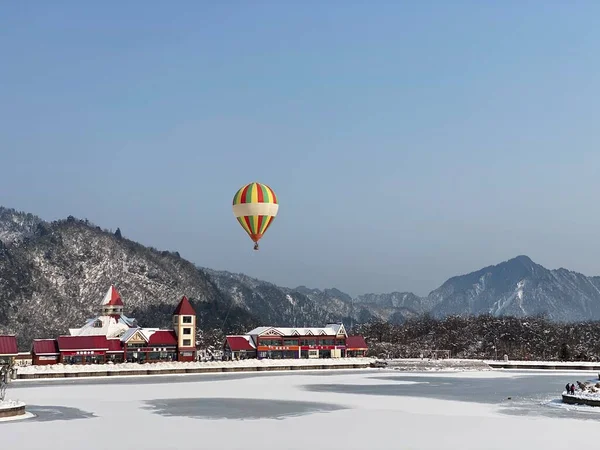 hot air balloon in the mountains