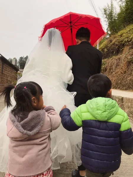 young couple with umbrella and tent