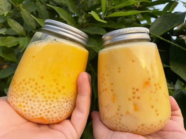 fresh mango juice in a glass jar