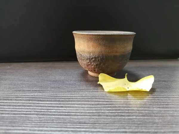 bowl with ceramic bowls and pestle on wooden table