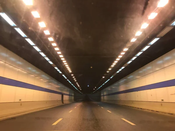 empty underground tunnel with lights and light trails