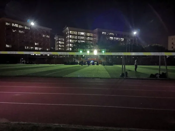 stadium with football field and lights