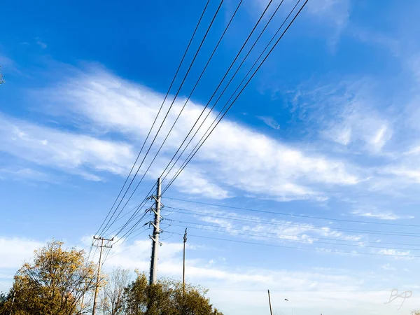 high voltage power lines and blue sky