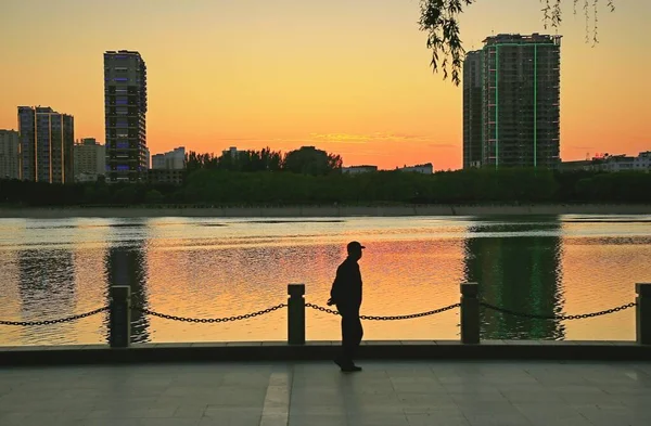 silhouette of a man on the bridge