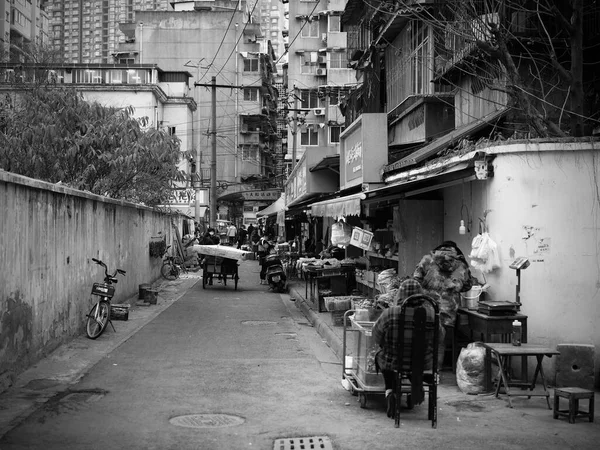 black and white photo of a street in the city