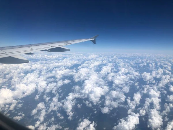 wing of a plane in the sky