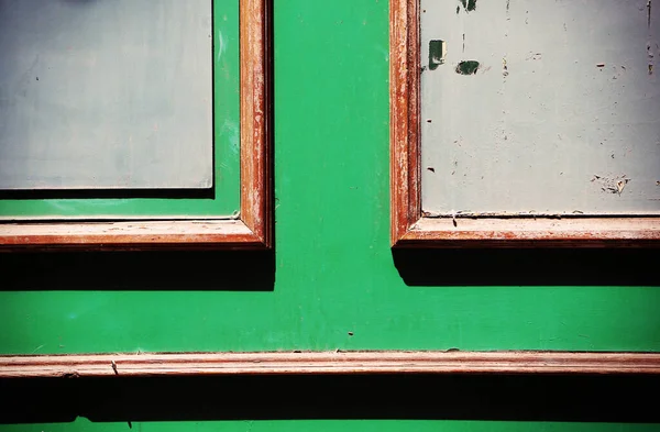 old wooden door with green and blue sky