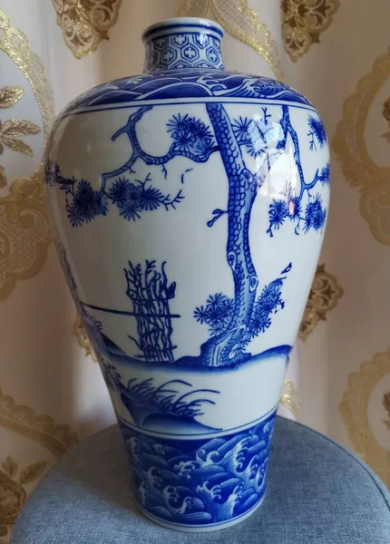 beautiful ceramic vase with blue flowers