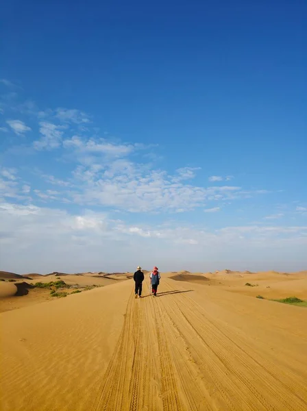 man and woman in the desert
