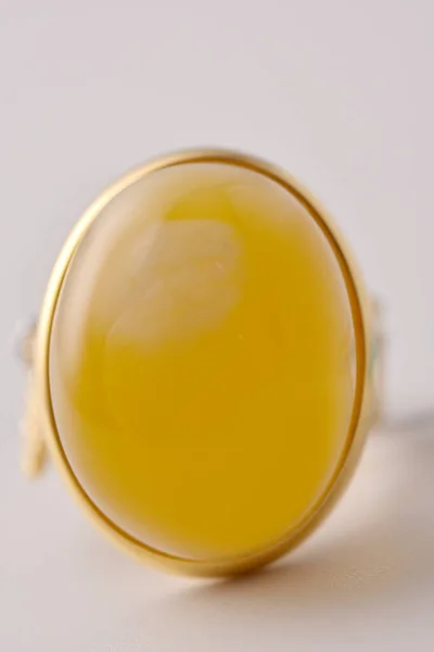glass of olive oil on white background