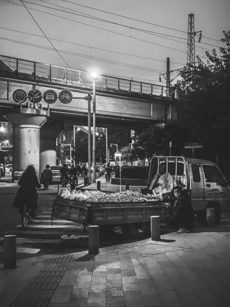 black and white photo of a street in the city