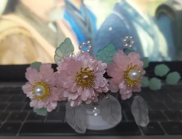 laptop with flowers on the table