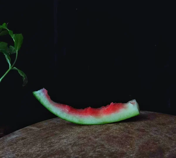 fresh ripe red watermelon on black background
