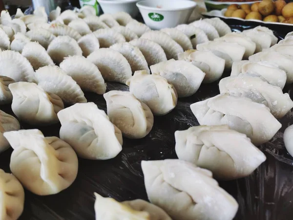 raw dumplings on the table