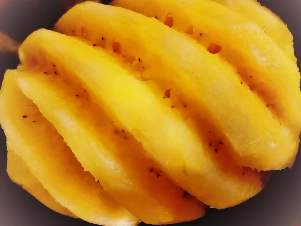 sliced ripe yellow banana slices on white background