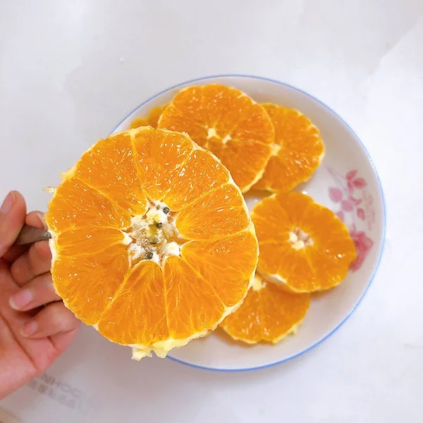 fresh orange fruit on a white background