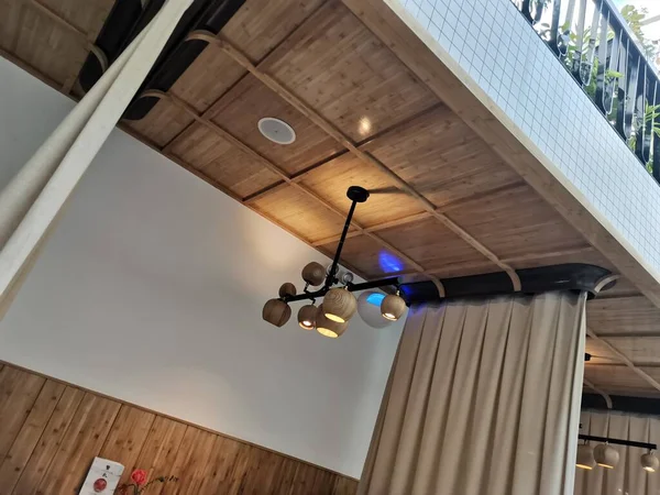 wooden ceiling with a window