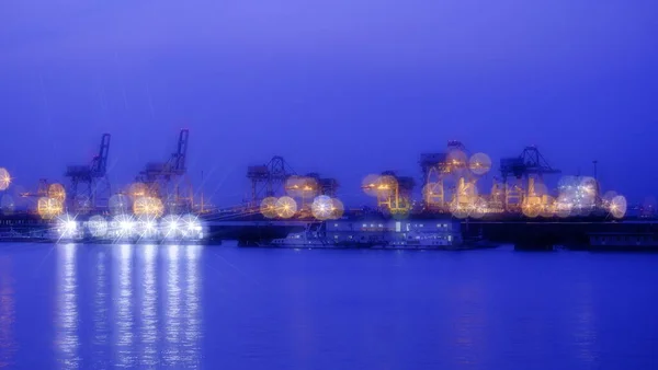 industrial port, cargo ship at night