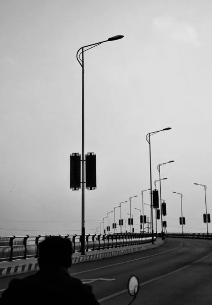 black and white photo of a street lamp