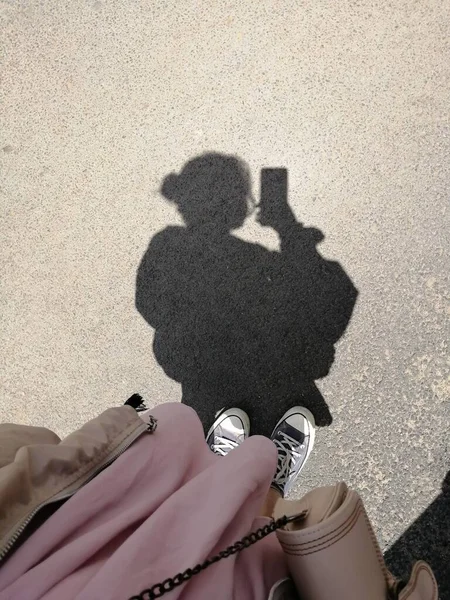 woman with bag and paper bags on the beach