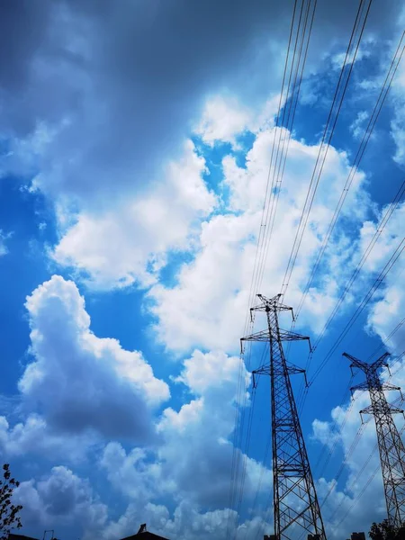 high voltage power lines and blue sky