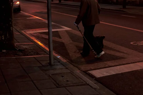 silhouette of a man in a suit walking on the street