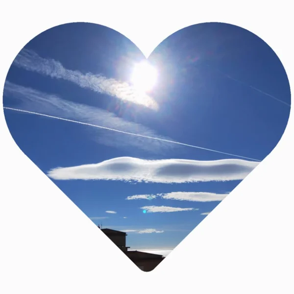 heart shape with sun and clouds