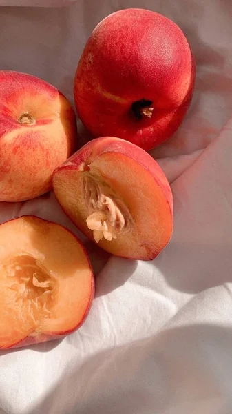 ripe peaches on a white background