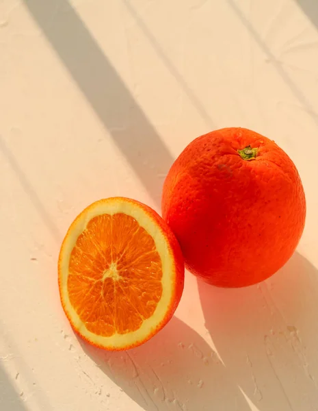 orange and yellow juicy oranges on a white background