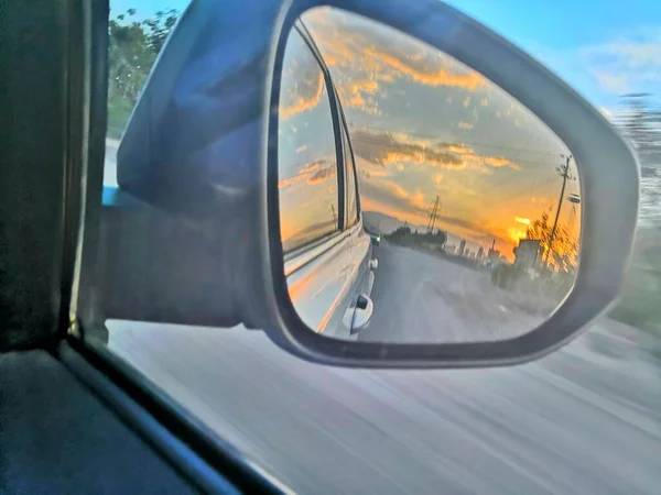 view of the road through the window of the car