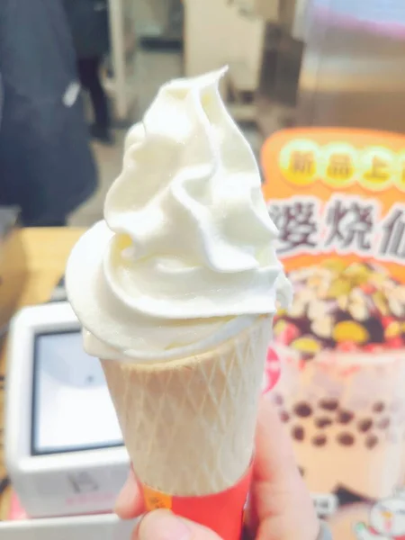 ice cream in a cup with a waffle cone