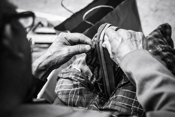 man with a tattoo on the background of the old sewing machine