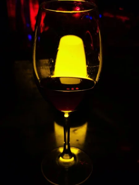 glass of red wine on a dark background