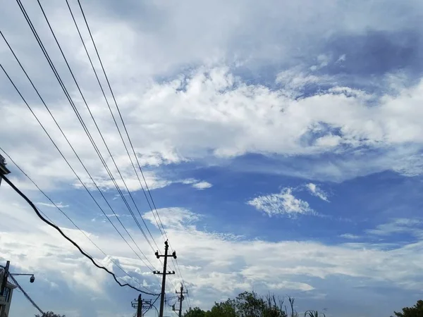 high voltage power lines and blue sky