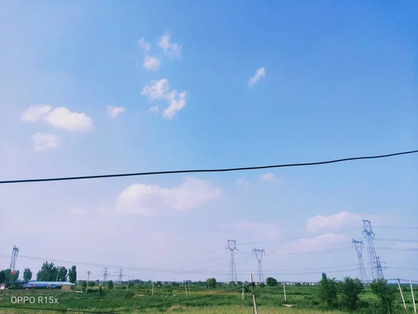 high voltage power line and blue sky