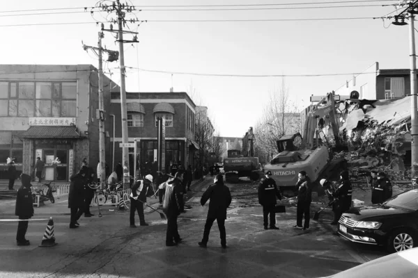 black and white photo of a street in the city