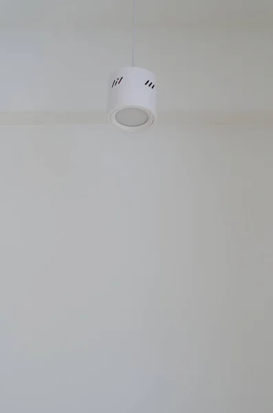 white ceiling lamp on wall background