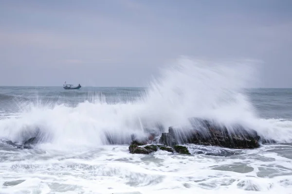 sea waves crashing on the beach