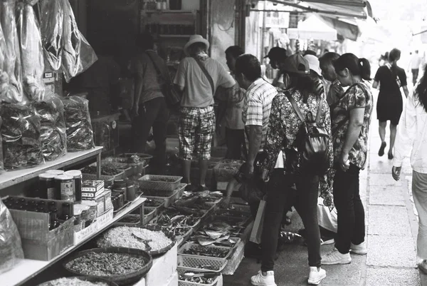 black and white image of a street food