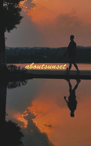 silhouette of a man in a lake