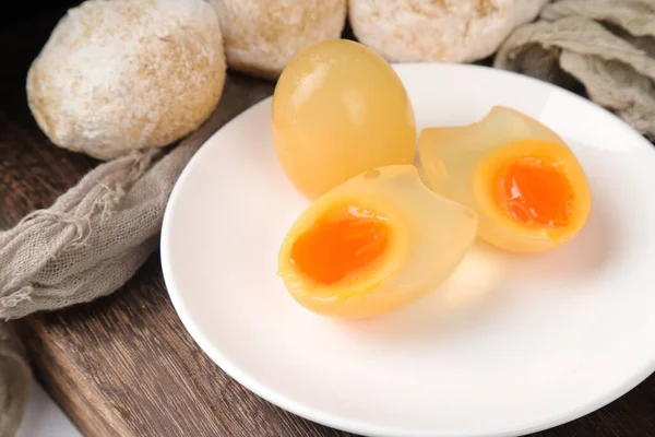 boiled egg with yolk and eggs on a plate