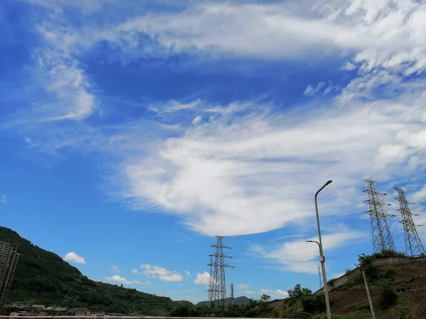 high voltage power lines and blue sky