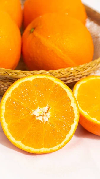 fresh orange and yellow oranges on white background