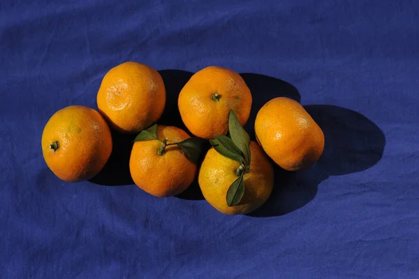 fresh ripe oranges on a black background