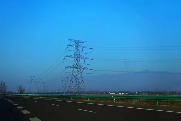high voltage power lines on the road